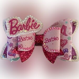 Barbie hand made faux leather bow. NEW Aprox 4” with alligator clip on the back.